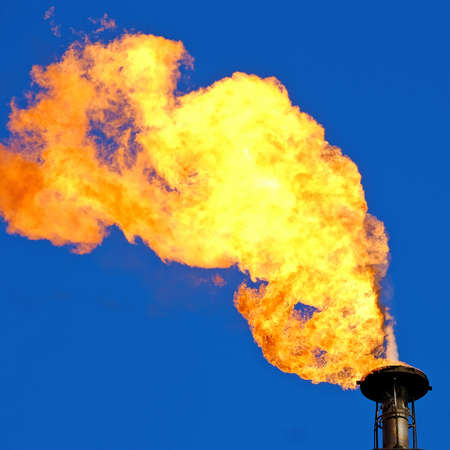 A torch at a gas processing plant. Background image for web designの写真素材