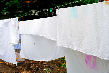 Sheets hang on a rope and dryの写真素材