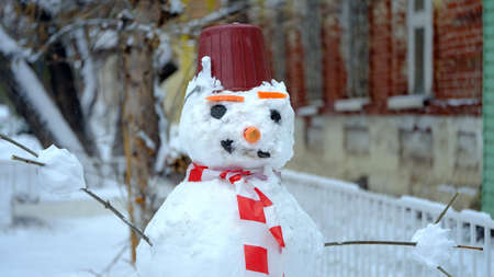 Snowman on the street of the cityの写真素材