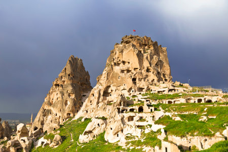 The Turkish fortress of Uchisar, Cappadocia, Turkey at the dark skyのeditorial素材
