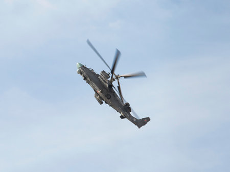 ZHUKOVSKY, RUSSIA - AUGUST 28, 2015: International aviation and space salon in Zhukovsky. The flight of the helicopter Ka-52 Alligator of military-air forces of Russiaのeditorial素材
