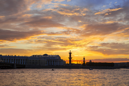 Sunset over Strelka - Spit of Vasilyevsky Island with the Old Stock Exchange and Rostral Columns, Saint-Petersburg, Russiaの写真素材