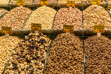 ISTANBUL, TURKEY - MAY 12, 2015: Various nuts and dried fruits on a counter on the Grand Bazaar in...