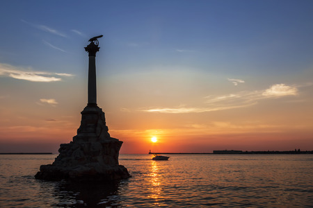 The Sevastopol Bay and the monument to the scuttled ships at sunset, Crimea, Russiaの写真素材