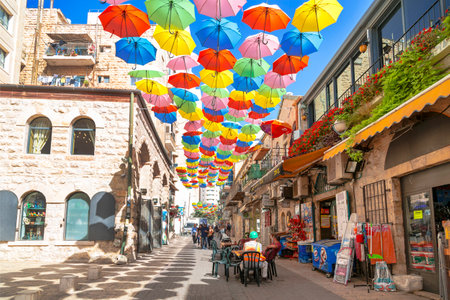 Yoel Moshe Salomon Street in Jerusalem in the historical district of Nachalat Shiva, decorated with brightly colored umbrellasのeditorial素材