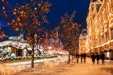 Winter Moscow, tourists are walking on Red Square near GUM in the evening. Russiaのeditorial素材