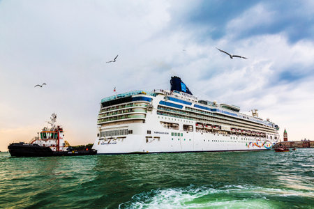 Ocean cruise liner and escort ships in the seaport in Venice, Italyのeditorial素材
