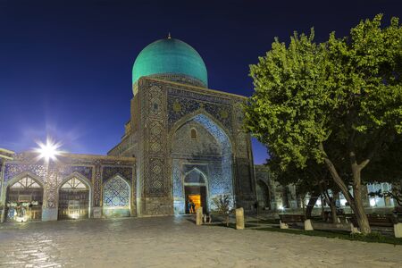 The inner courtyard of the Ulugbek madrasah at night. Uzbekistanの写真素材