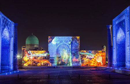 View of Registan square in Samarkand with Ulugbek madrasah, Sherdor madrasah and Tillya-Kari madrasah at night with a laser show on the history of the East. Uzbekistanのeditorial素材