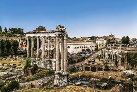 Roman forum with the temple of Saturn and the temple of Vespasian and Titus in the foreground. Rome, Italyの写真素材