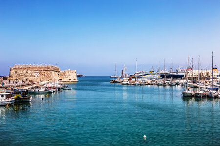 View of the medieval sea fortress Coules and the old port on a sunny summer day. Heraklion, Crete, Greeceのeditorial素材