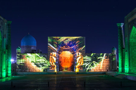 View of Registan square in Samarkand with Ulugbek madrasah, Sherdor madrasah and Tillya-Kari madrasah at night with a laser show on the history of the East. Uzbekistanのeditorial素材