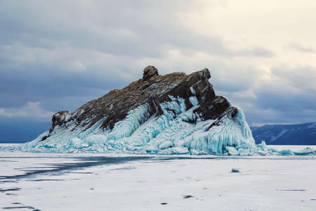 Yelenka rock on lake Baikal in winter at sunset, Eastern Siberia, Russiaの写真素材