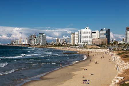 View of Tel Aviv with urban development and people on the beach by the Mediterranean Sea. Israelのeditorial素材