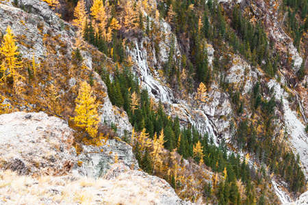View of the slopes of the Katu-Yaryk pass with a waterfall in the Ulagan district of the Altai...