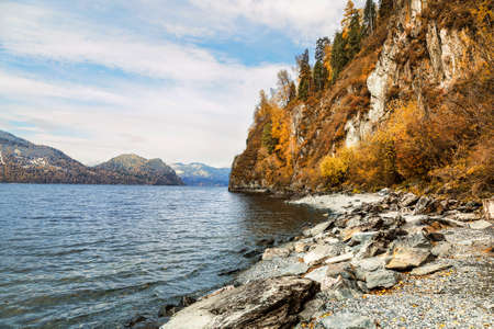 Russia, the Altai Republic. Picturesque autumn view of the Teletskoye lake surrounded by mountainsの写真素材