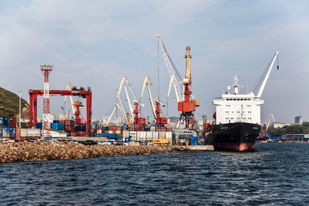 Cargo container ship at the berth of the cargo port in Vladivostok. Far East, Russia