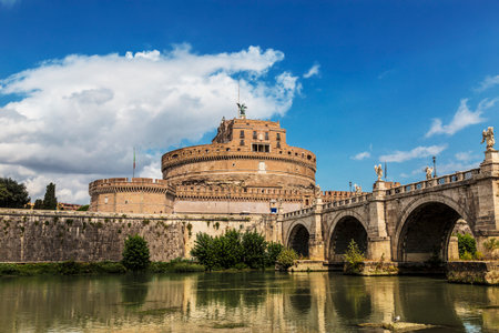 View of the Castle of the Holy Angel, aka Hadrian's Castle and the bridge of the Holy Angel across the Tiber River. Rome, Italyのeditorial素材