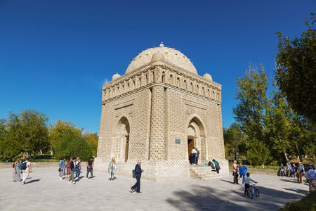 Bukhara, Uzbekistan. View of the Samanid mausoleum, an architectural monument of the early Middle Ages and tourists around itのeditorial素材