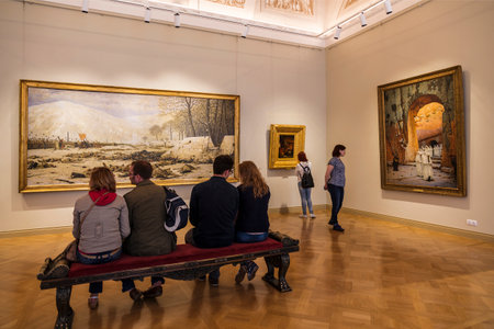 Visitors in the hall of the famous Russian battle painter of the 19th century Vereshchagin VV Russian Museum, St. Petersburg, Russiaのeditorial素材