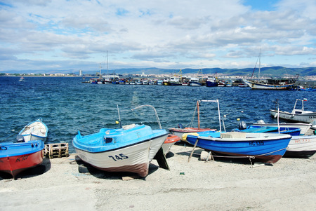 Many boats at the pier in the absence of waves on the waterの写真素材