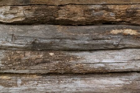 Old wooden background of horizontal logs, boards.Texture. Photo background.Textile.Wall or floor of...