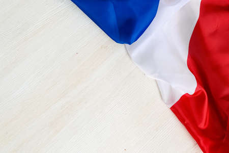 Flag of France on a white background. Happy Bastille Day. 14th July. Celebrating a public holiday. Independence Day. Greeting card or banner. Top view. Layoutの写真素材