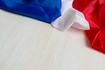 Flag of France on a white background. Happy Bastille Day. 14th July. Celebrating a public holiday. Independence Day. Greeting card or banner. Top view. Layoutの写真素材