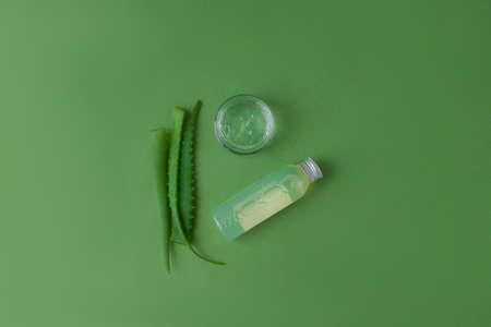 Skin, face, body, and hair care products. Eco-friendly natural cosmetics on a green background. beauty concept. top view. flat lay.の写真素材