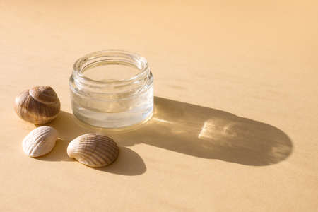 Skin, face, body care products. Eco-friendly natural cosmetics with the addition of vitamins, serum prebiotics and mineral complexi on beige background. beauty concept. Hard light and shadows.の写真素材