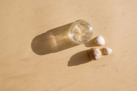 Skin, face, body care products. Eco-friendly natural cosmetics with the addition of vitamins, serum prebiotics and mineral complexi on beige background. beauty concept. Hard light and shadows.の写真素材