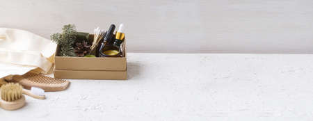 Eco cosmetic products for skin care of the face, body in a natural paper box. Glass cosmetic bottles...