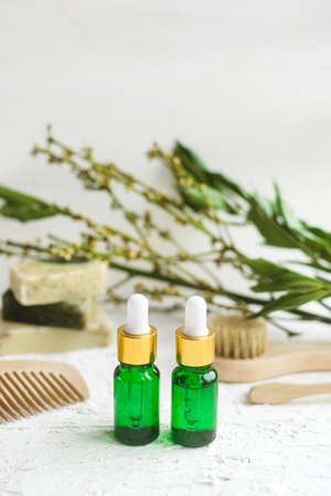 Eco cosmetic products for skin care. Glass cosmetic bottles and soap with natural essential oil, vitamin and prebiotic serum for health.の写真素材