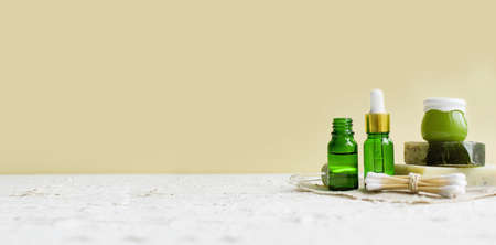 Eco cosmetic products for skin care of the face, body. Glass cosmetic bottles with natural essential oil, vitamin and prebiotic serum for health. banner with copy spaceの写真素材