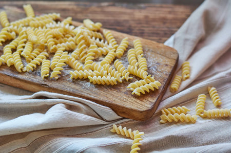 pasta on an old wooden tableの写真素材
