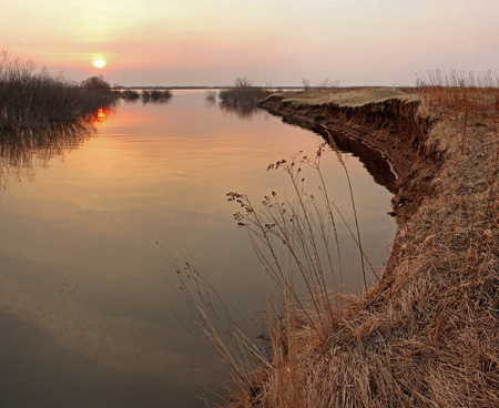 Sunset on the river during the floods in the spring panoramaの写真素材