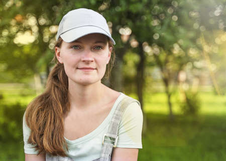 young beautiful girl wearing the hat, sunny day, pretty woman