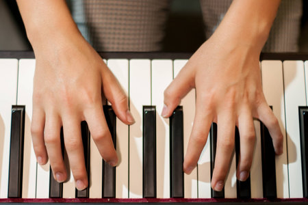 The girl plays the pianoの写真素材