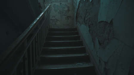Destroyed school in Beslan after the terrorist attack. Old empty school corridors. The camera walks up the stairs.の写真素材