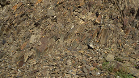 Stones at the foot of the mountain. Close-up of brown rock.の写真素材