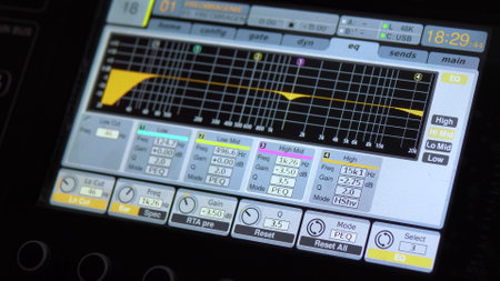 Sound tuning on a professional electronic mixer. Control panel for tuning sound channels. Monitor electronic mixer. Close-up.の写真素材