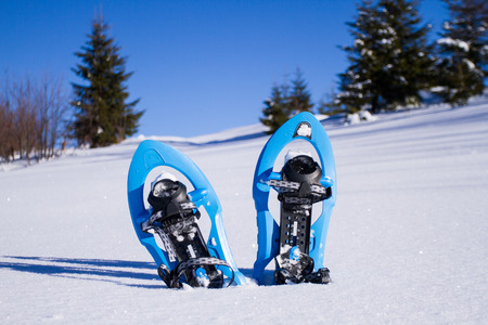 Snowshoeing. Snowshoes in the snow.