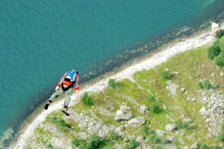 Jump off a cliff with a rope, mountain, sea, nature,の写真素材