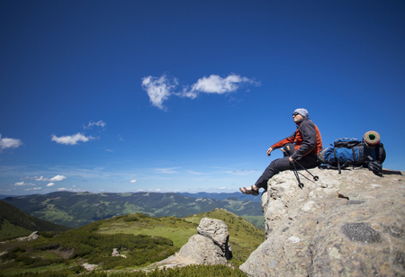 Summer hiking in the mountains with a backpack and tent.の写真素材