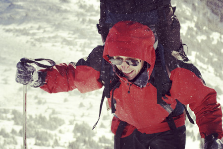 Winter hiking in the mountains on snowshoes with a backpack and tent.の写真素材