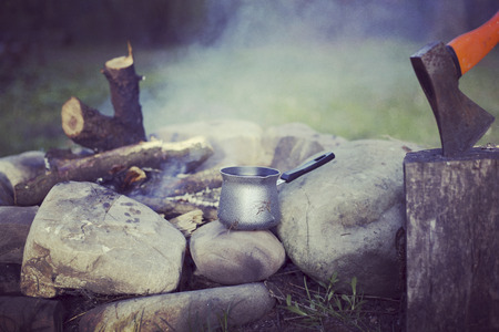 Cooking breakfast on a campfire at a summer camp.の写真素材