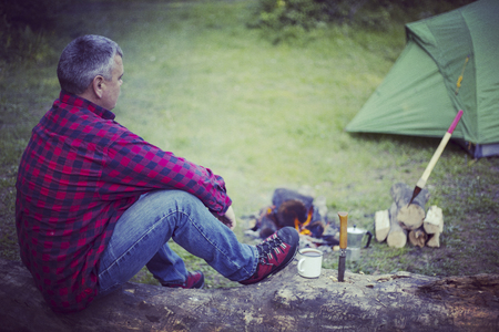 Cooking breakfast on a campfire at a summer camp.の写真素材