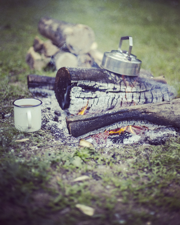 Cooking breakfast on a campfire at a summer camp.の写真素材
