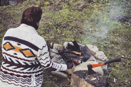 Cooking breakfast on a campfire at a summer camp.の写真素材