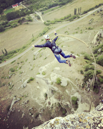 Jump off a cliff into a canyon with a rope.